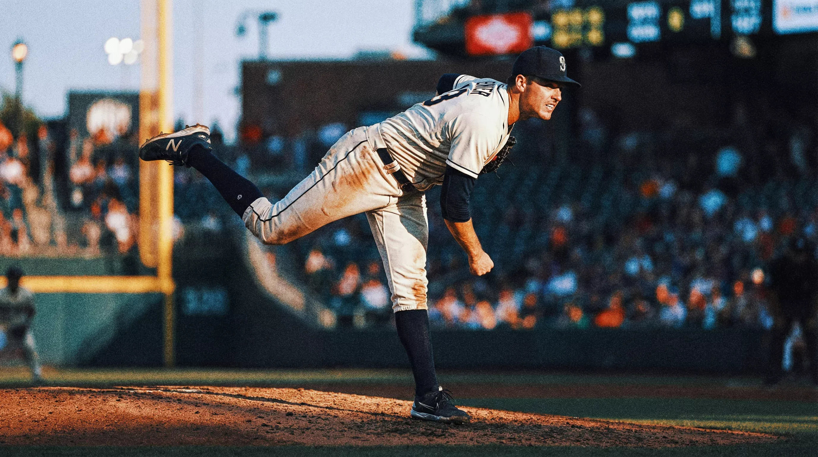 Lanceur de baseball en plein mouvement de lancer sur le monticule